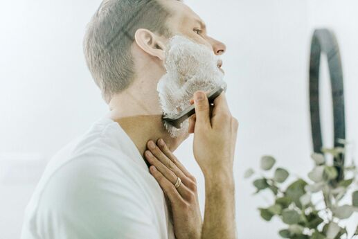 man shaving face